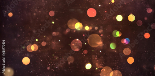 Abstract glowing bokeh lights on dark background