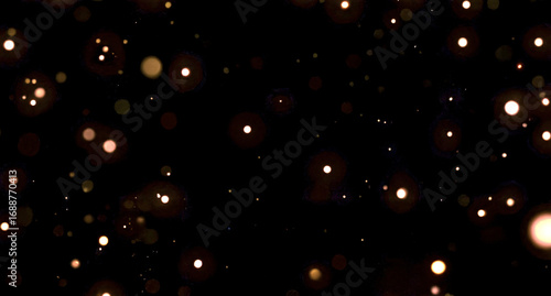 Glowing orange bokeh lights on dark background