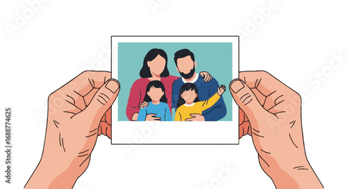 Hands holding a cherished family photograph featuring a happy mother, father, and two young daughters, capturing memories.