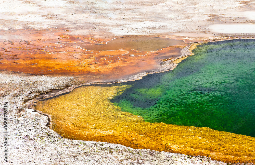 Obraz premium Colorful Geothermal Hot Spring with Mineral Deposits and Vibrant Water