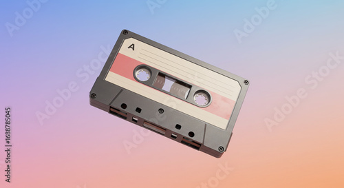 A vintage cassette tape floats against a colorful, gradient background, showcasing retro audio technology.