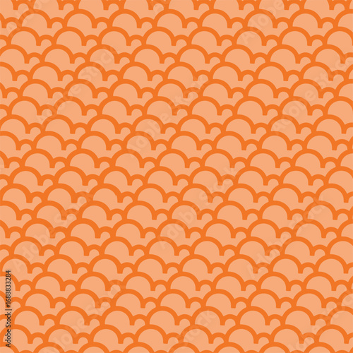 A seamless orange scales pattern background with repetitive overlapping shapes inspired by fish scales and traditional geometric motifs. The bold and vibrant design is perfect for textiles, wallpapers