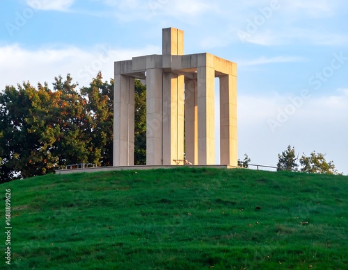 Modern monument on a grassy hill