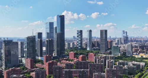 Aerial view of modern city with blue sky and clouds