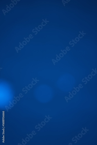 Vertical dark blue abstract background with cinematic bokeh effect. Moody and premium composition, perfect for mobile wallpapers, story templates, or professional presentations with copy space.