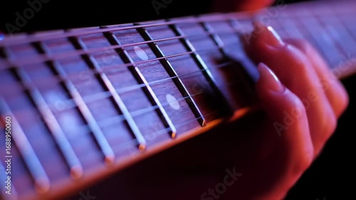 Wallpaper Mural Close-up of a hand playing strings on a fretboard guitar Torontodigital.ca
