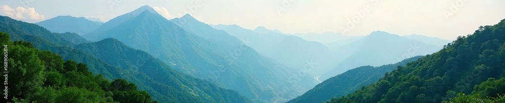 Fototapeta premium Serene mountain landscape perfect for a peaceful retreat Misty peaks, lush greenery, and a tranquil atmosphere ideal for relaxation and rejuvenation , horizon, fog