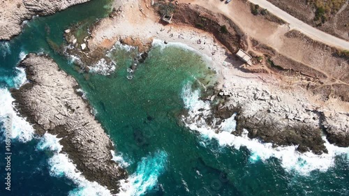 Beautiful Drone Panorama of Clear Sea Water with Waves Hitting Rugged Cliffs