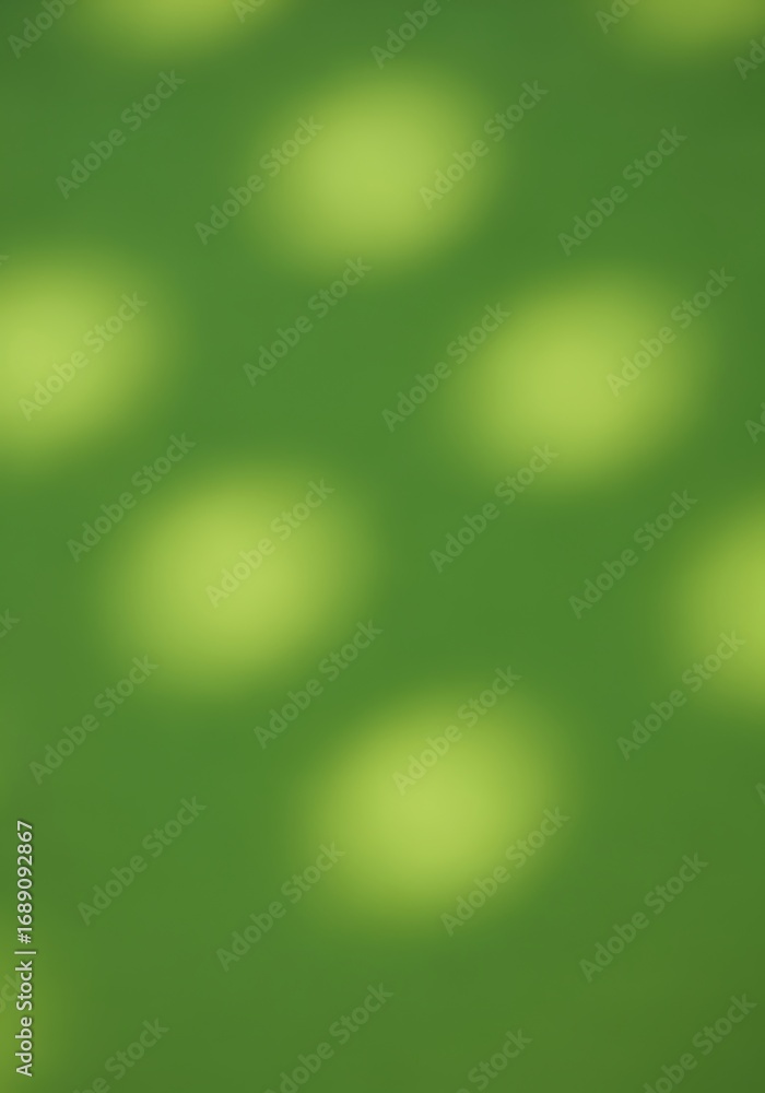Obraz premium Soft, diffused light casts hazy, pale yellow-green circles across a vibrant green background.