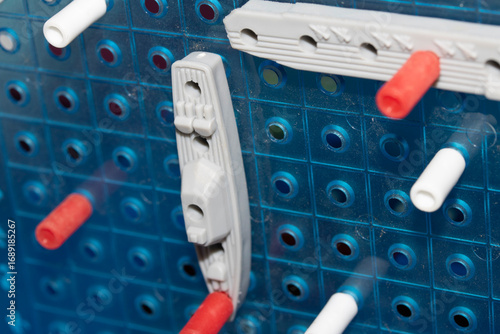 Canvas Print Close up of strategic battleships board game with ships and pegs