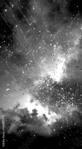 A monochrome image portrays a dramatic sky filled with clouds, falling particles, and light streams, creating an ethereal and dynamic abstract effect