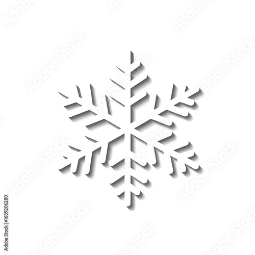White snowflake casting shadow on clean white surface creating wintery and minimalistic atmosphere with simple elegance and cool, crisp feeling.