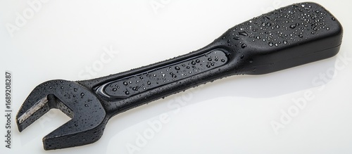 Black Wrench Covered with Water Droplets Isolated on White Background