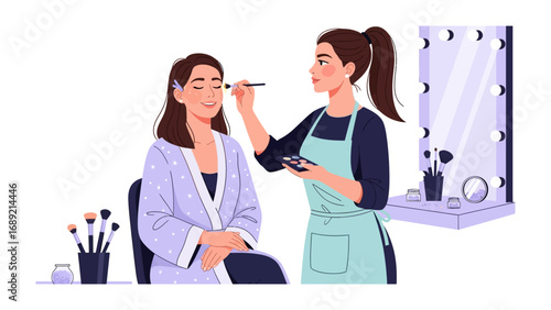 Professional makeup artist applying cosmetics to a client in a brightly lit studio setting