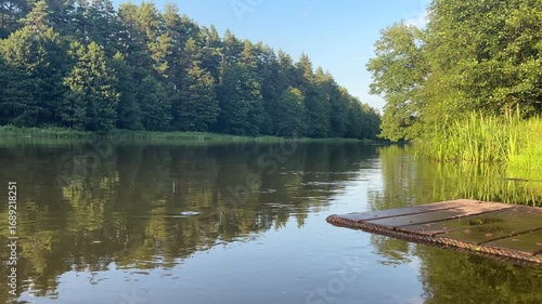 Wallpaper Mural Serene Moments by the Calm Riverbank at Golden Hour in Peaceful Nature Retreat Torontodigital.ca