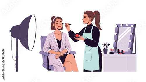 Professional makeup artist applying cosmetics to a client in a studio setting with lighting and mirror