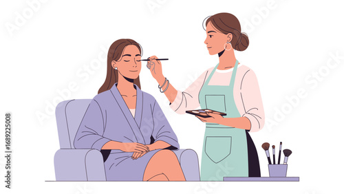 Professional makeup artist applying eye makeup to a client sitting in a salon chair wearing a robe