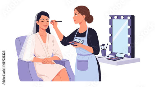Professional makeup artist applying cosmetics to a bride in a salon with a lighted mirror