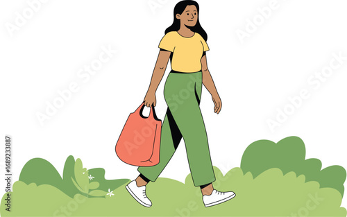 Woman walking with shopping bag in nature