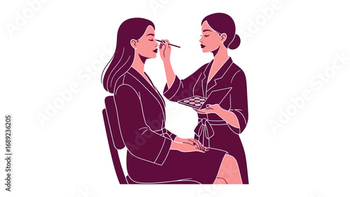 Two women in matching silk robes applying makeup to each other in a serene beauty ritual