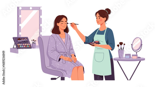 Professional makeup artist applying cosmetics to a client in a well lit beauty studio with vanity mirror