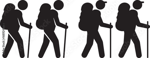 Four hikers walking with backpacks and poles silhouette