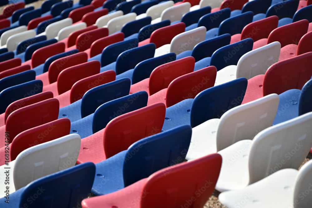 Naklejka premium Colorful Stadium Seats Arranged in Patterns at The National Stadium in Phnom Penh