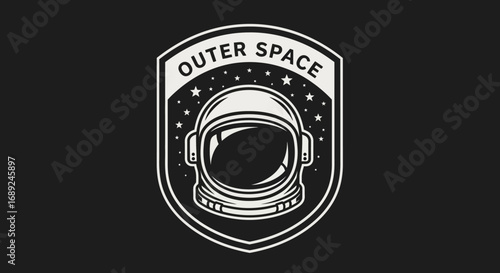 Vintage style emblem of an astronaut helmet, set within a shield, symbolizing outer space exploration.