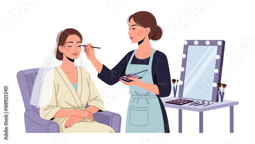 Professional makeup artist applying cosmetics to a client in a salon setting with illuminated mirror