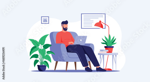 Man sitting comfortably in armchair working on laptop in a relaxing home office setup