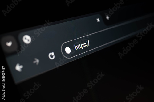 Close-up of a dark browser address bar with highlighted HTTPS protocol, symbolizing internet security, website encryption, and safe browsing. Ideal for cybersecurity and web development themes.