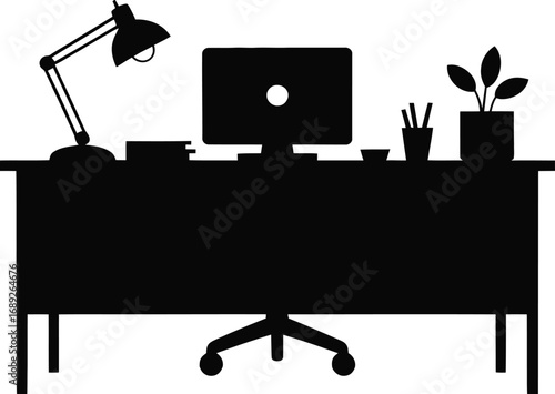 Desk with computer lamp and plant office