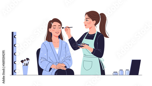 Professional makeup artist applying cosmetic products to a smiling woman s face in a studio setting
