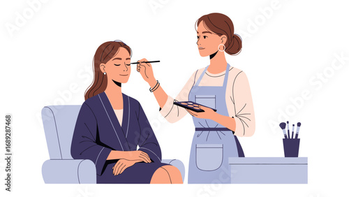 Professional makeup artist applying cosmetics to a client sitting in a chair with a makeup palette and brushes nearby