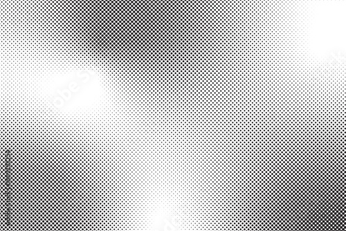 Halftone pattern with varying dot density, creating a gradient effect, black and white.