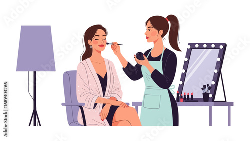 Professional makeup artist applying cosmetics to a client in a studio setting with mirror and lighting