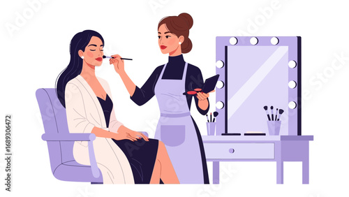 Professional makeup artist applying cosmetics to a client in a well lit studio with a vanity mirror