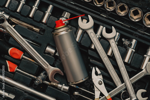Toolbox with wrenches and aerosol spray can for maintenance