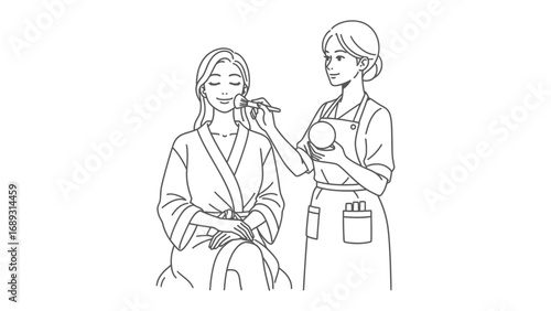 Stylist applying makeup to a woman wearing a robe and headband in a salon setting