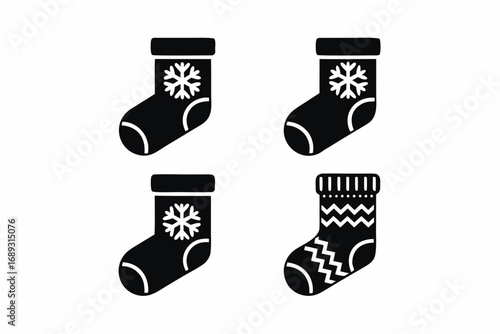 Set of four black and white christmas stocking icons with snowflake and geometric patterns on a white background