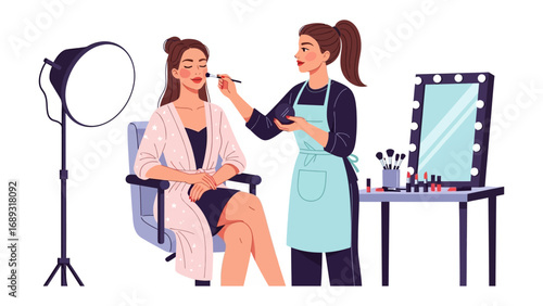 Professional makeup artist applying cosmetics to a model in a studio setting with lighting and mirror