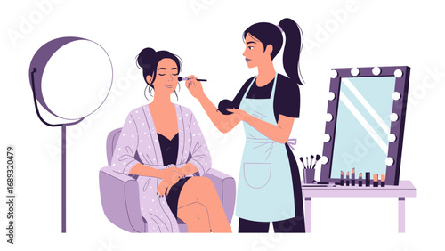 Professional makeup artist applying cosmetics to a model in a studio setting with lighting and mirror