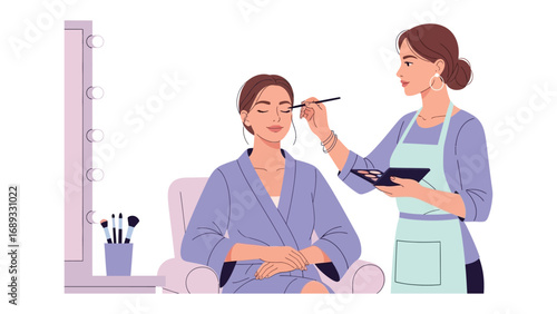 Professional makeup artist applying eyeshadow to a woman sitting in a chair in a beauty salon
