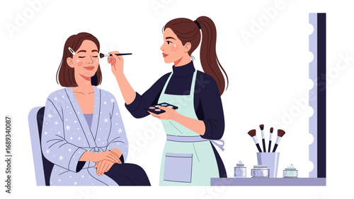 Professional makeup artist applying cosmetics to a woman s face with a brush in a bright clean studio setting