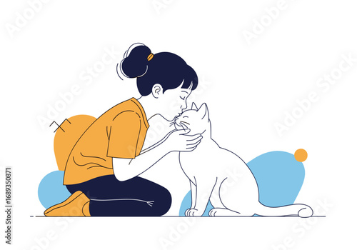 Young woman gently kissing her white cat on the head while sitting on the floor with decorative elements in the background