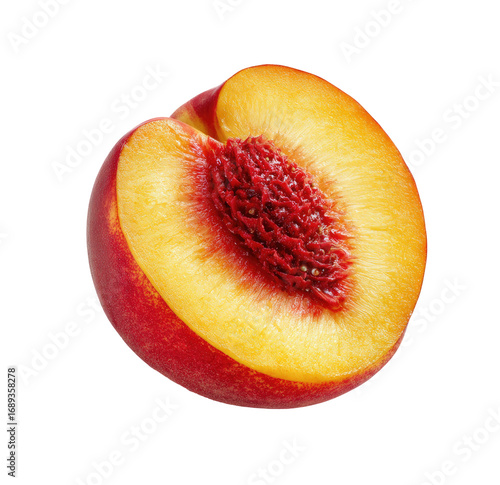 Close-up of a peach half, showing the red skin, juicy yellow flesh, and seed