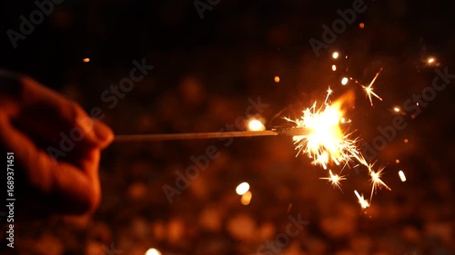 [Super Slow Motion] Happy children playing with sparklers in the garden on a summer evening
