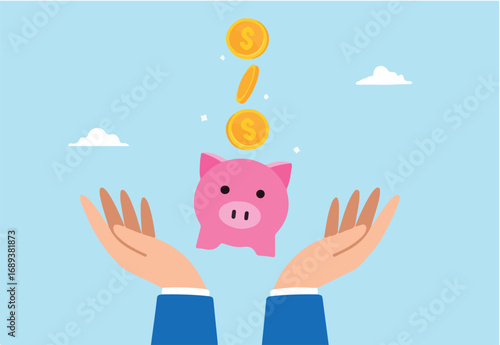 Gold money dollar coins drop into hand holding piggy bank