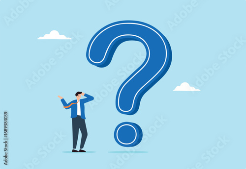 Businessman thinking while looking at big question mark, illustrating problem or challenge that requires solution. Concept of doubt or uncertainty, thinking and decision making in difficult situation