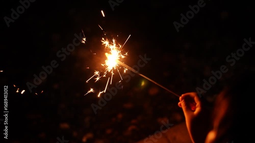 [Super Slow Motion] A summer tradition of children enjoying sparklers with family in the evening